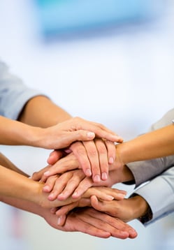 Business group with hands together - teamwork concepts