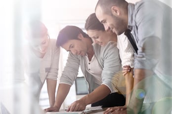 Group of business people in office working on project