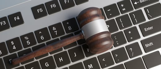 cyber-crime-concept-law-gavel-on-computer-keyboard-WENM2GD