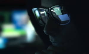 nerd-hacker-with-glasses-in-the-dark-Z632G4Q